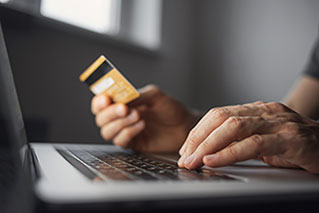 person holding credit card